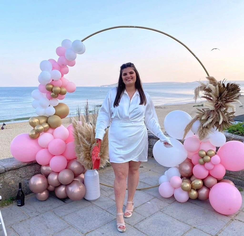 A woman wearing a white satin dress.