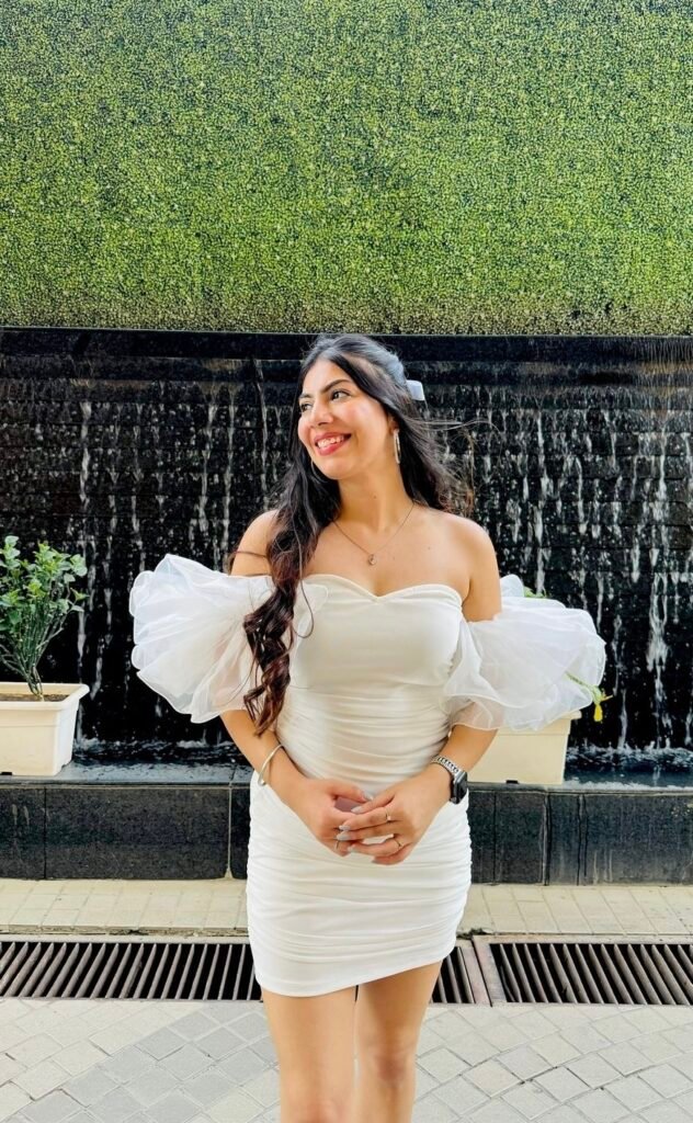 A woman wearing a white bustier dress.