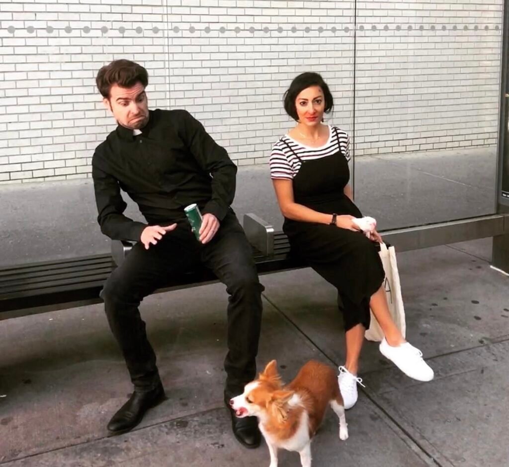 A couple wearing Fleabag and the Priest Halloween costumes.
