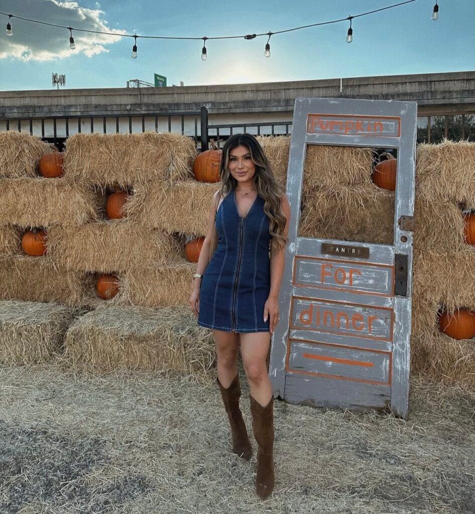 A woman wearing a denim dress.