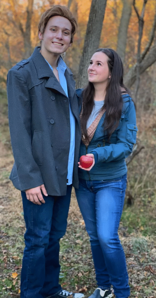 A couple wearing Bella and Edward Halloween costumes.