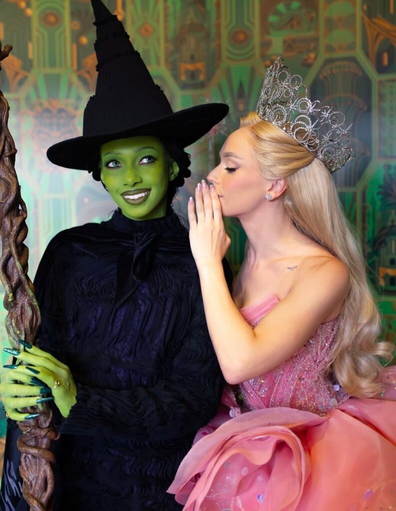 Best friends wearing Glinda and Elphaba Halloween costumes.