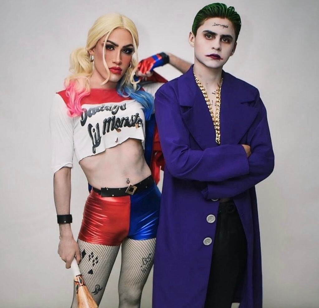 A couple wearing Harley Queen and Joker Halloween costumes.