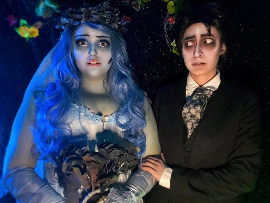 A couple wearing Emily and Victor Halloween costumes.