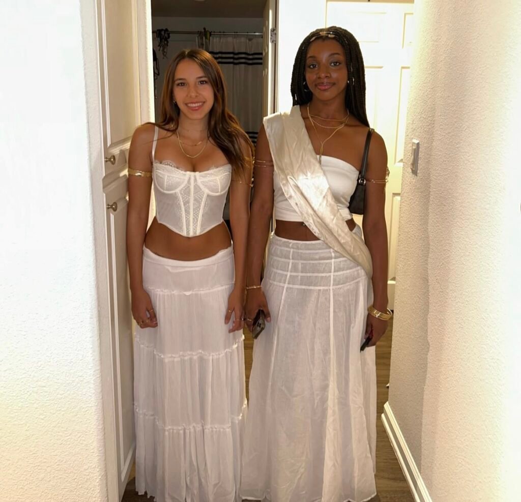 Best friends wearing Greek goddess Halloween costumes.