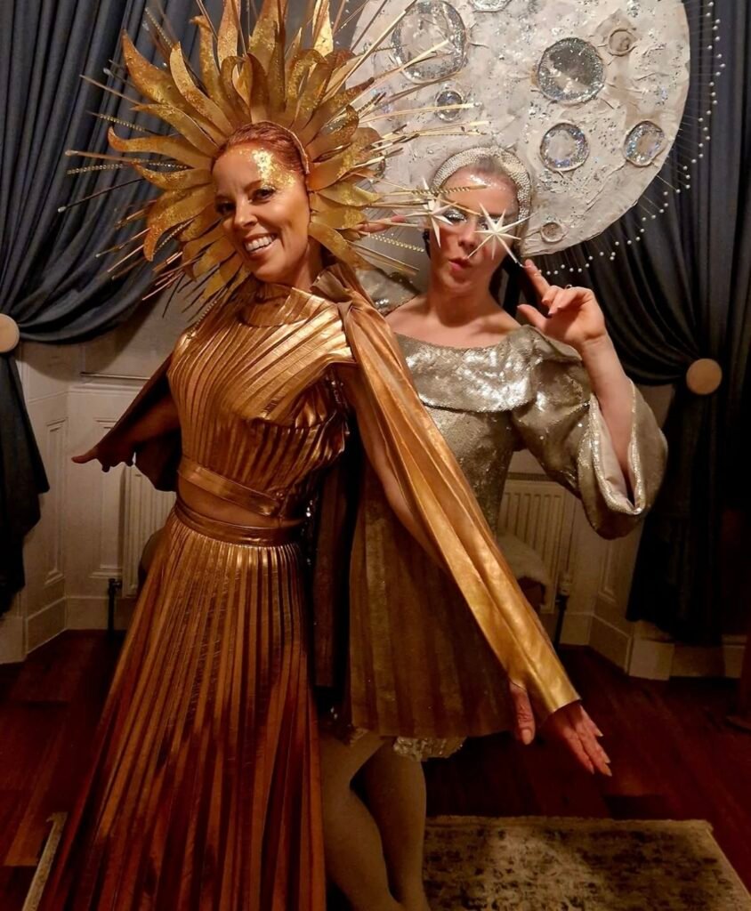 Best friends wearing sun and moon Halloween costumes.