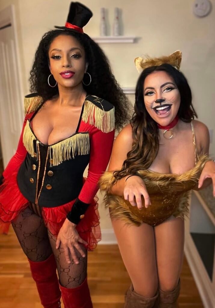 Best friends wearing magician and lion Halloween costumes.
