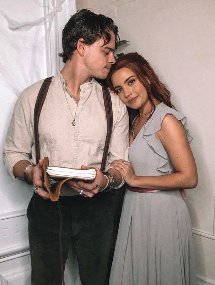 A couple wearing Jack and Rose Halloween costumes.