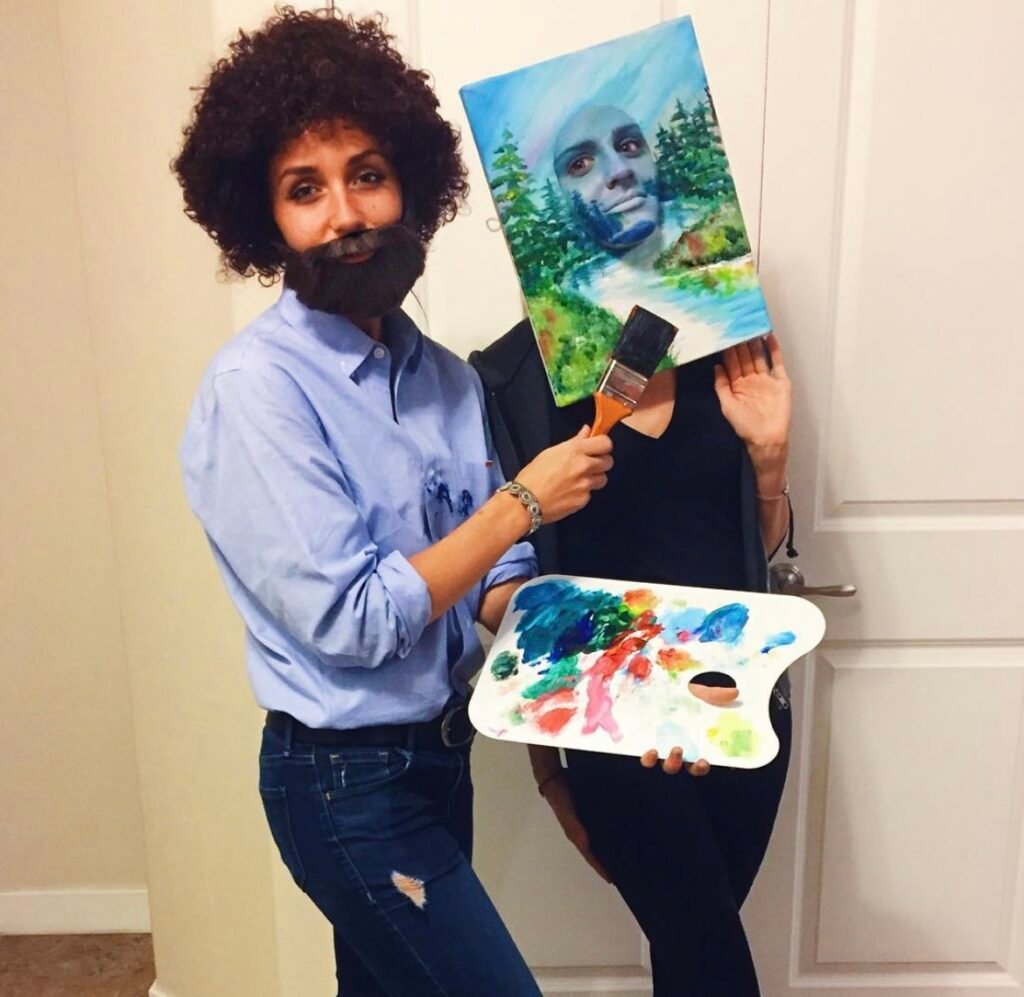 Best friends wearing Bob Ross and his painting Halloween costumes.
