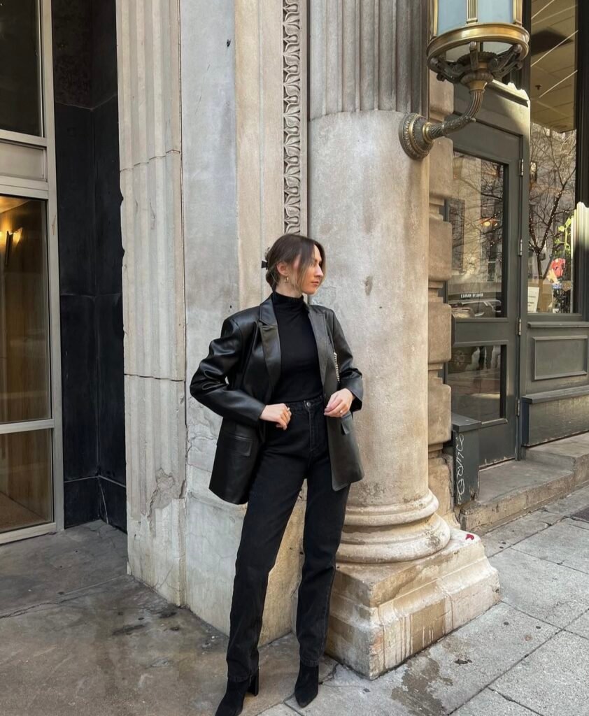 A woman wearing an all black outfit.