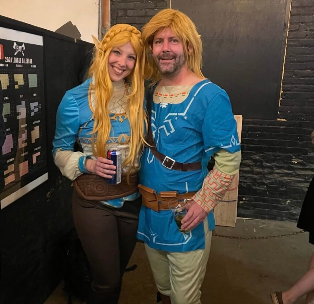 A couple wearing Zelda and Link Halloween costumes.
