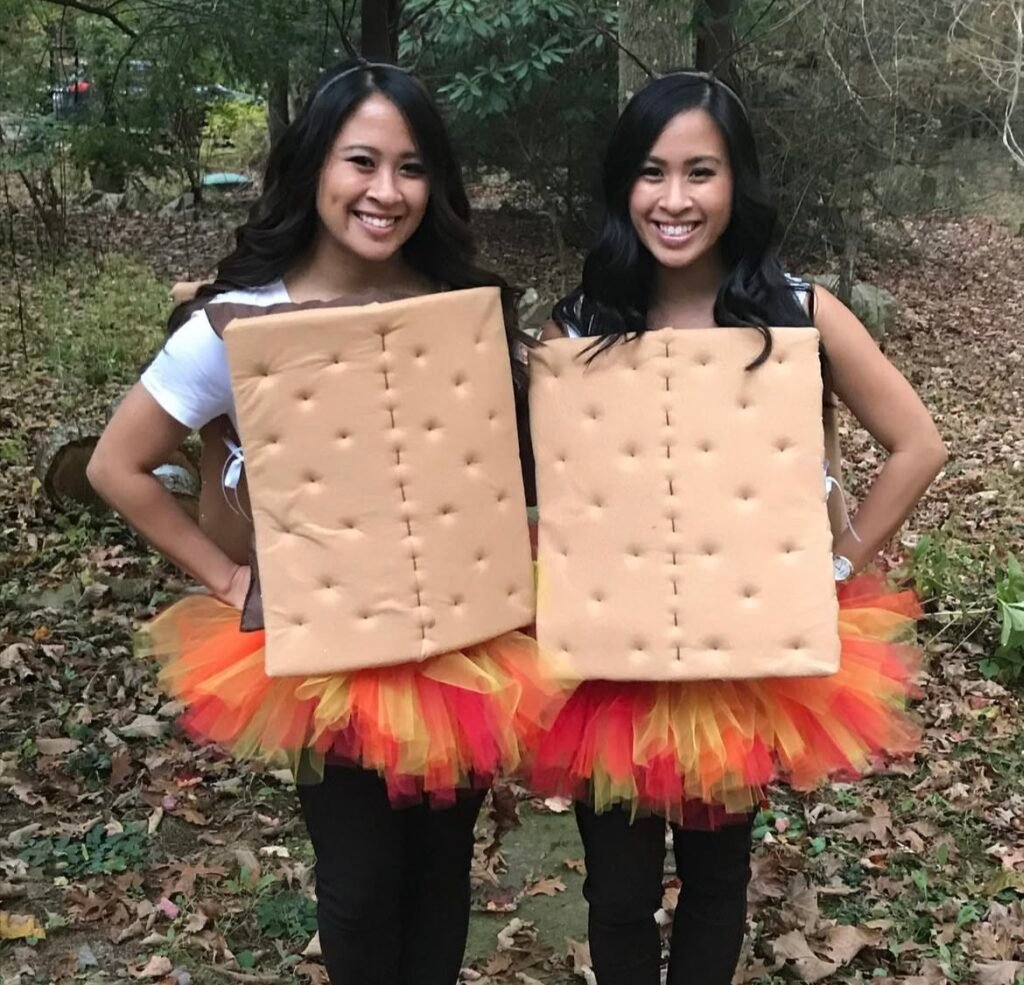 Best friends wearing S'mores and campfire Halloween costumes.