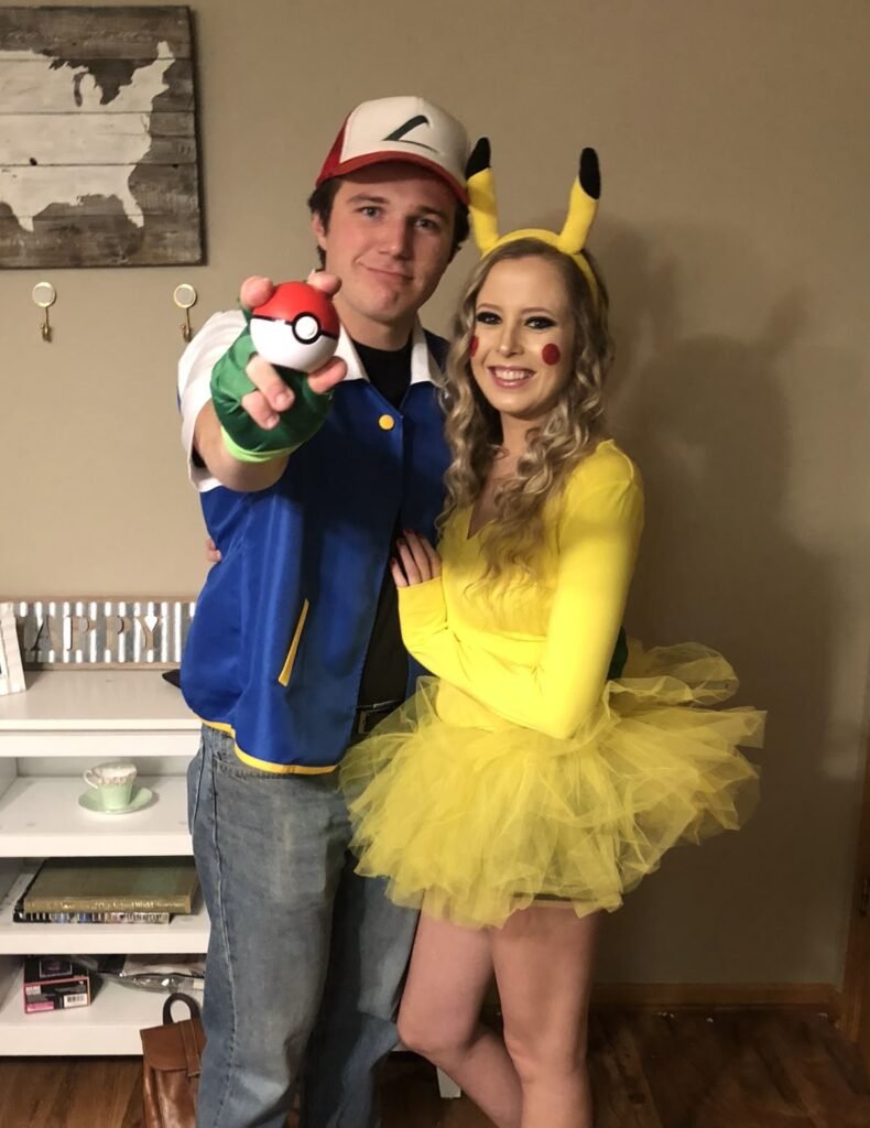 A couple wearing Pikachu and Ash Halloween costumes.