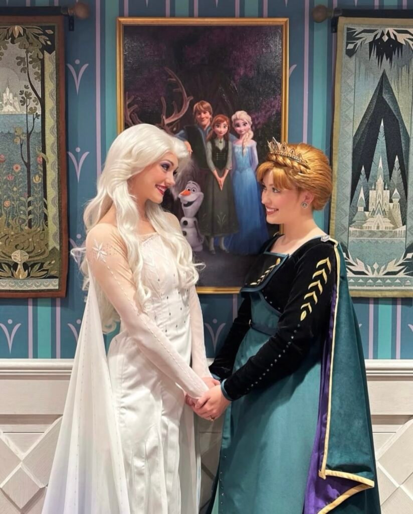 Best friends wearing Elsa and Anna Halloween costumes.