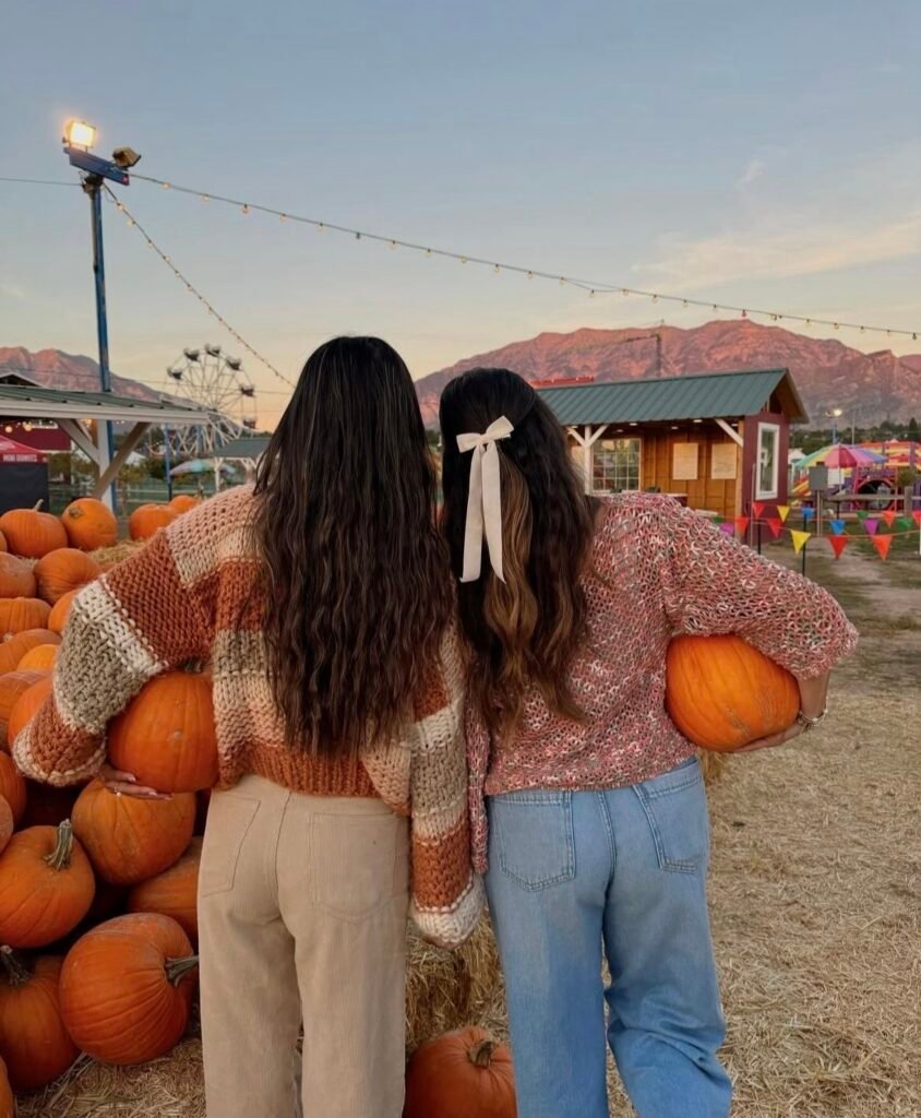 Best friends wearing cozy sweaters with jeans.