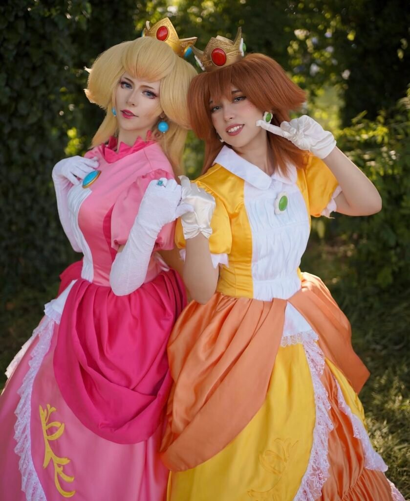 Best friends wearing Peach and Daisy Halloween costumes.