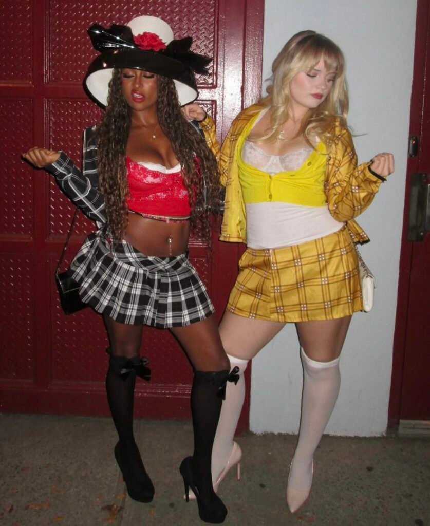 Best friends wearing Cher and Dionne Halloween costumes.