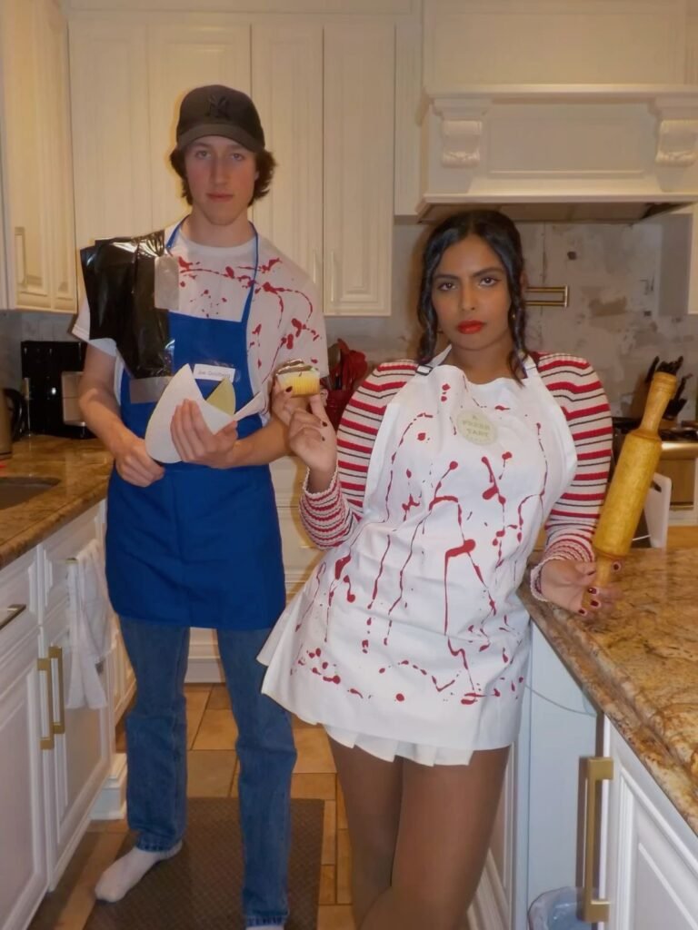 A couple wearing Joe and Love Halloween costumes.