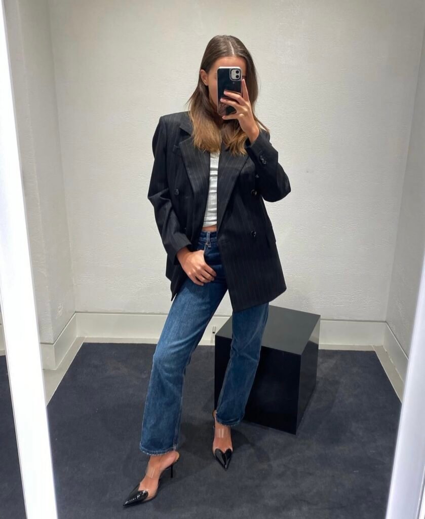 A blazer and jeans outfit.