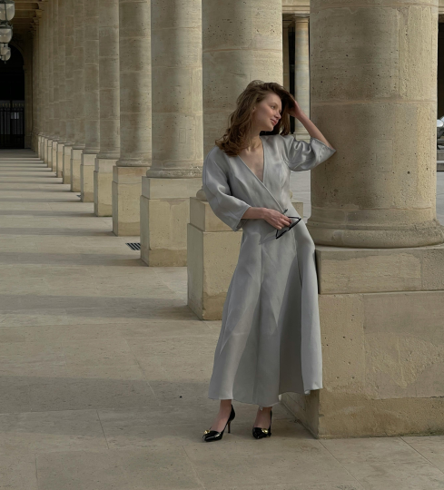 A woman wearing a blue dress.