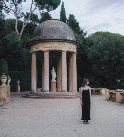 A woman wearing a black dress.