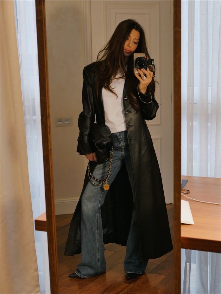 A black trench coat outfit.