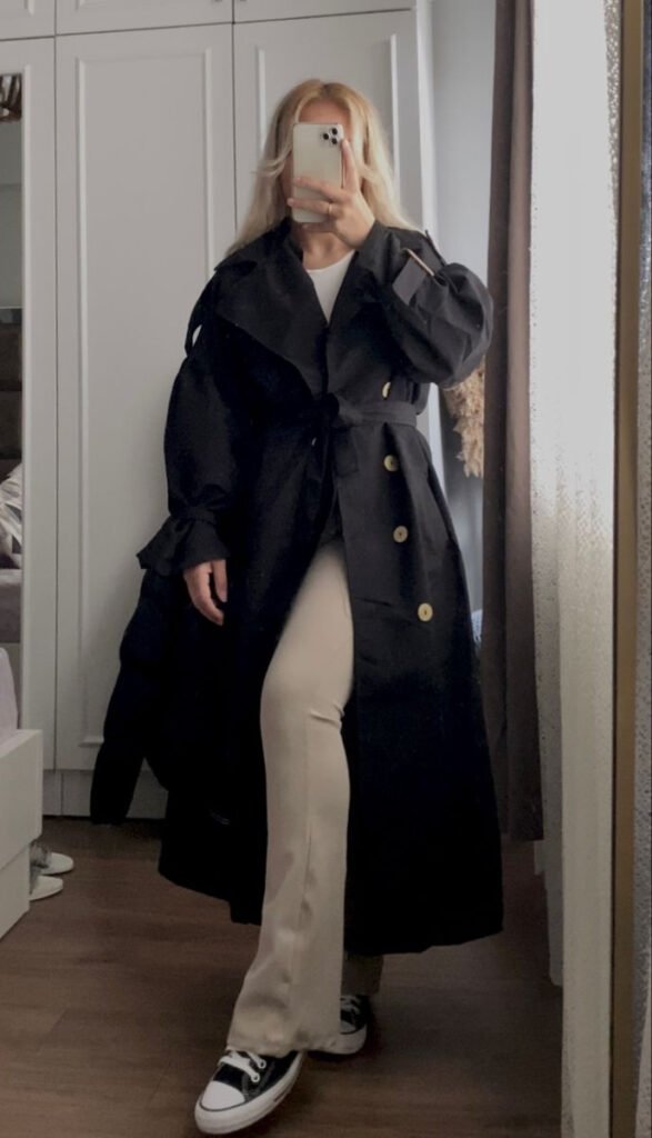 A black trench coat outfit.