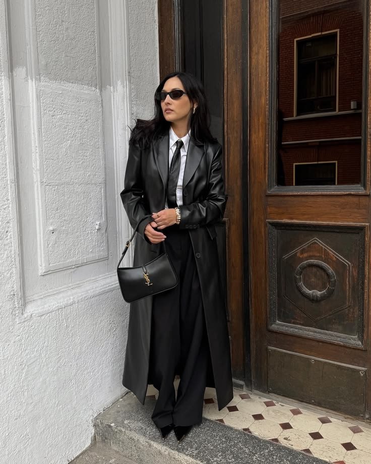A black trench coat outfit.