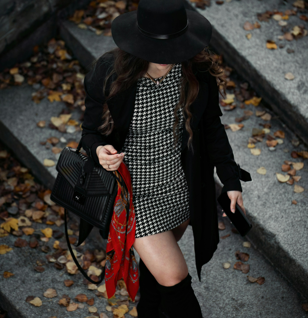 A black trench coat outfit.