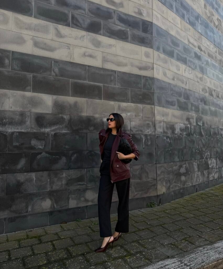 An outfit with a black faux leather jacket.