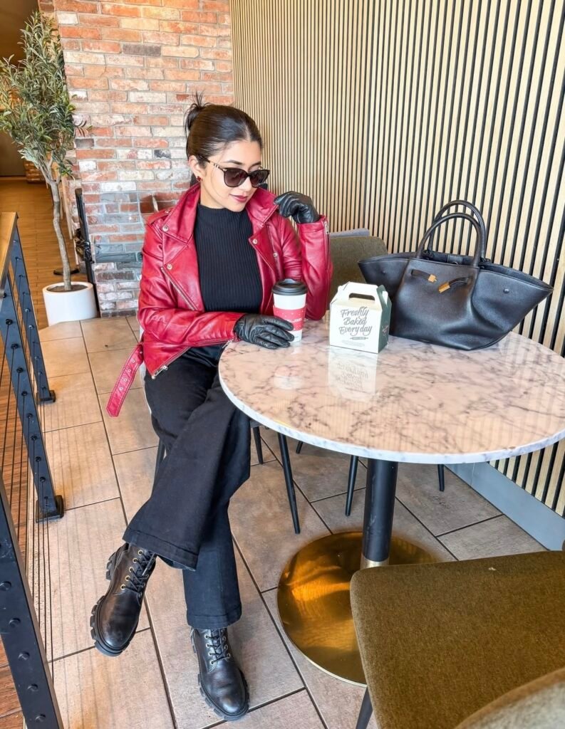 An outfit with a black faux leather jacket.