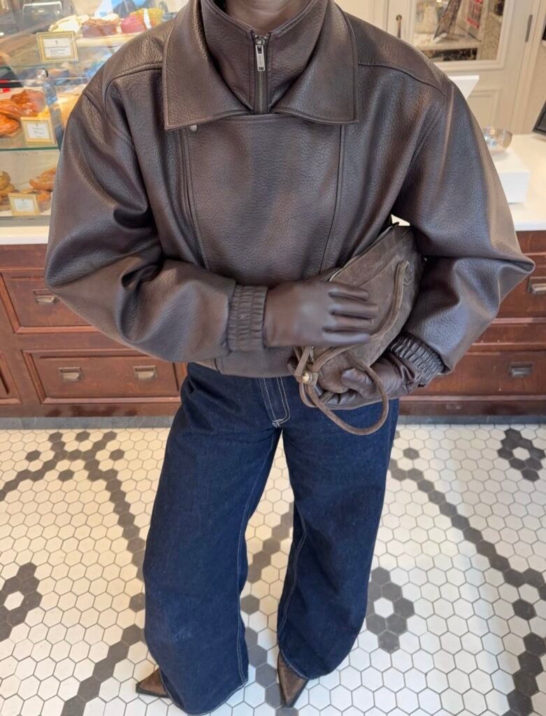 An outfit with a black faux leather jacket.