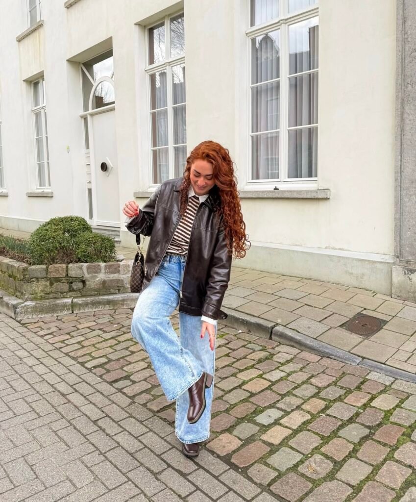 An outfit with a black faux leather jacket.