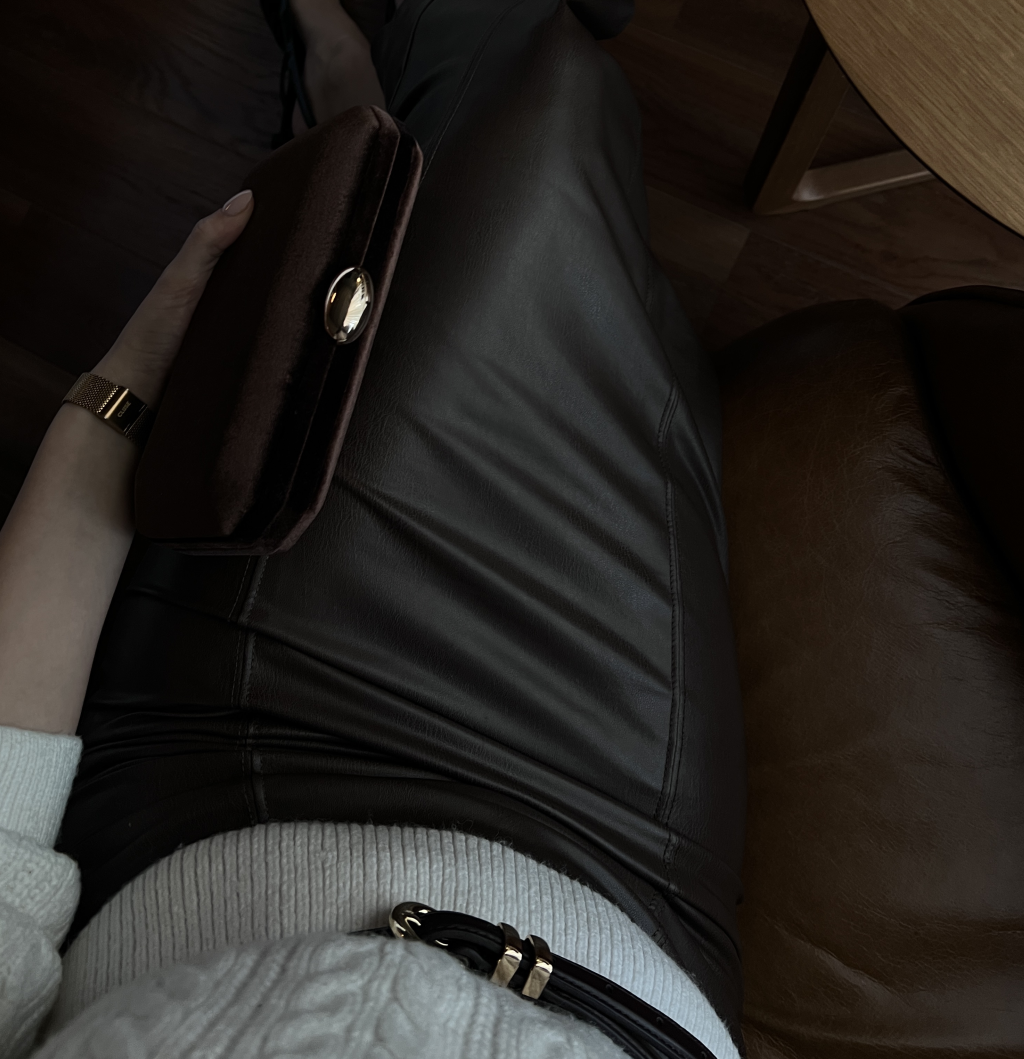 A leather skirt outfit.